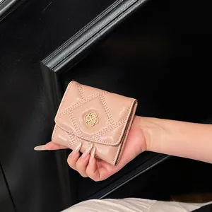 Elegant pink quilted short wallet with a chic gold metal logo for women and girls