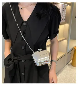 Elegant silver metallic acrylic evening clutch bag with chic chain strap for party