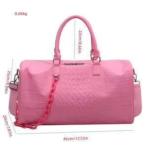 Large pink crocodile texture travel duffel bag showing detailed size measurements