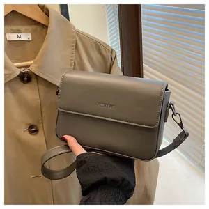 Elegant vintage grey small square crossbody bag for women featuring Tommy Knight logo detail