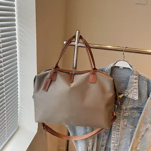 Large capacity khaki nylon travel duffle bag for gym, weekend trips and business.