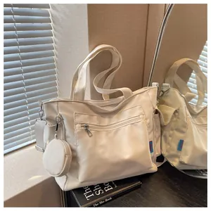 Cream canvas tote bag with large capacity and matching coin purse