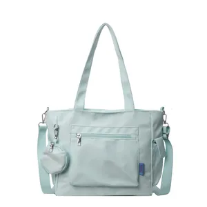 Light blue large capacity canvas tote bag with crossbody strap and small round purse