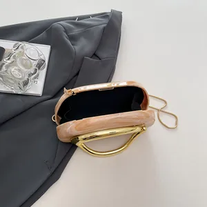Marble acrylic round evening clutch bag with elegant gold metal handle and chain