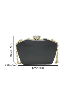 Black acrylic evening clutch bag with gold chain strap and dimension markings in inches