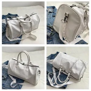 Large white crocodile pattern duffel bag with shoulder strap and decorative chain