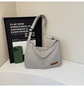 Minimalist large capacity grey nylon messenger bag with adjustable shoulder strap