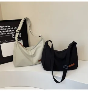 Minimalist large capacity nylon crossbody messenger bags for daily commute and leisure.