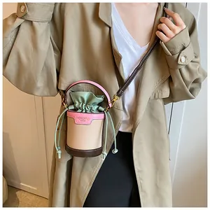 Small cylinder bucket bag with pink and beige patchwork for women