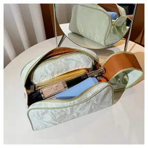 Detailed view of large capacity makeup bag showing organized interior with cosmetics