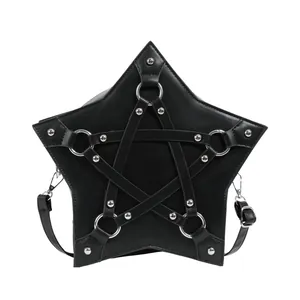 Detailed view of a black star-shaped crossbody bag with silver harness strap accents