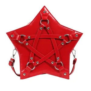 Detailed view of a red star-shaped crossbody bag with silver rivet hardware.