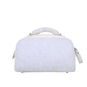 Front view of a white fuzzy cosmetic bag showing soft plush texture and top handle.