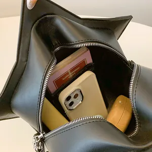 Chic black star-shaped crossbody handbag for women showing spacious interior capacity