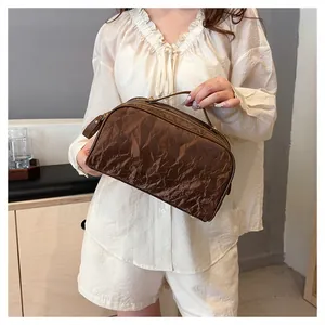 Large capacity brown cosmetic bag with stylish wrinkled texture and convenient top handle