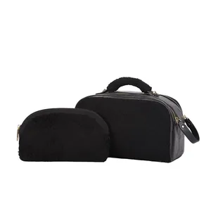 Two-piece set of black fluffy faux fur cosmetic bags with elegant gold zipper details