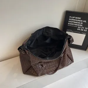 Internal view of brown woven travel bag with spacious storage pockets and lining
