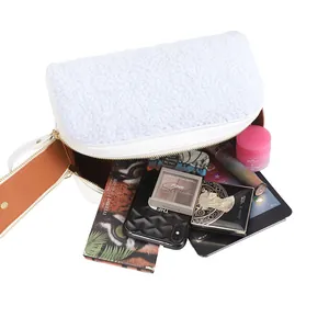 Stylish white furry large capacity makeup bag showing interior storage for cosmetics