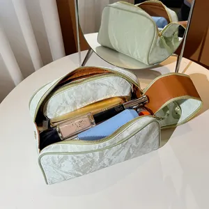 Premium high-capacity white textured portable cosmetic makeup bag for women 2024