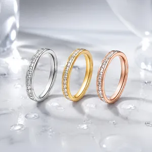 Detail view of eternity rings in silver, gold, and rose gold with square zircons