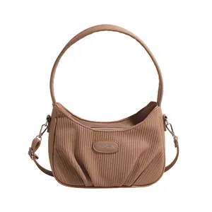Fashionable brown pleated cloud handbag with adjustable crossbody strap and top handle