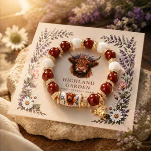 Handmade Highland Cow beaded stretch bracelet with a charming nature-inspired theme detail