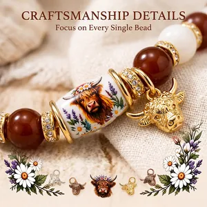 Close-up of handcrafted Highland Cow beaded bracelet with gold charms and rich brown beads
