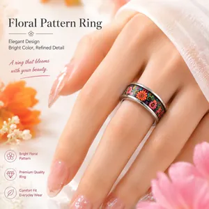 Close-up of elegant stainless steel ring featuring vibrant floral pattern on model hand
