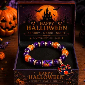 Detailed view of Halloween beaded bracelet with pumpkin charm in themed gift box