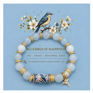 Handmade bluebird of happiness beaded bracelet with golden hummingbird charm and card