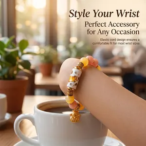 Charming beaded bracelet featuring cute cat patterns and golden lucky cat charms for women.