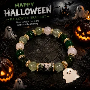 Macro detail shot showing Halloween crystal beaded bracelet with a cute ghost charm pendant