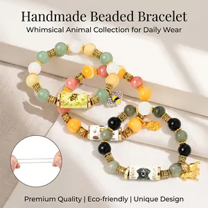 Detailed view of handmade animal bracelets with bee and dog charms and elastic cord