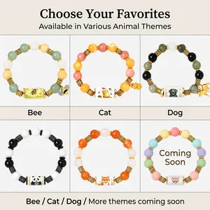 Detailed view of various animal themed beaded bracelets with metal tube charms.