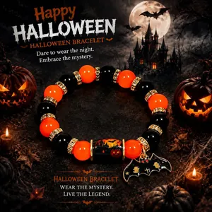 Close-up of Halloween beaded bracelet with bat charm and spooky pumpkin barrel bead.