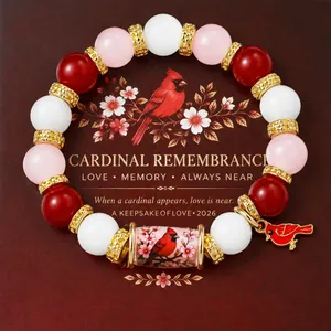 Handmade cardinal memorial beaded bracelet with red, pink and white beads on a gift card.