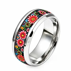 Vibrant floral pattern stainless steel ring for women on a clean white background.