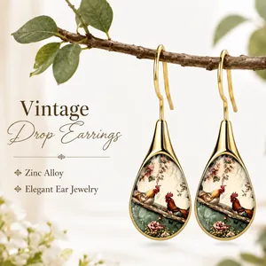Detailed close-up view of vintage zinc alloy drop earrings with rooster and floral art