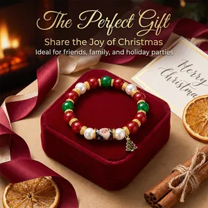 Close-up of Christmas beaded bracelet with Santa Claus and tree charm on velvet box