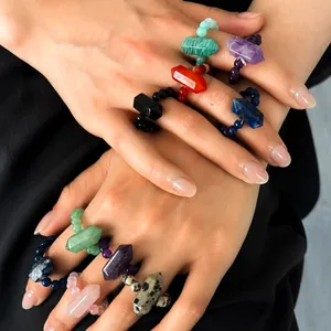 Detailed view of stackable natural stone rings with hexagonal crystal points