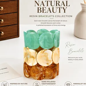 Detailed view of irregular marbled resin bracelets in green, cream, and amber tones.