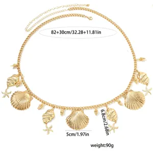 Detailed view of gold starfish and shell charm waist chain with measurements