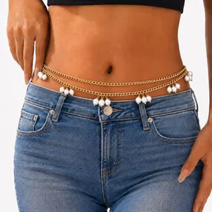 Detailed view of gold-tone double-layered body waist chain with hanging white pearl charms