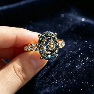 Close-up detail of celestial sun god ring with blue enamel moon and gold sun face