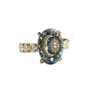 Vintage celestial sun and moon face ring in gold-tone with brilliant cubic zirconia