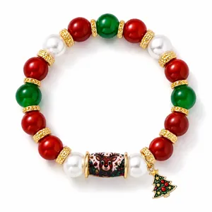 Festive Christmas beaded bracelet featuring reindeer patterns and a mini tree charm