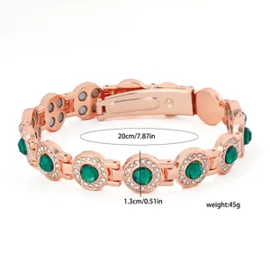 Close-up of rose gold magnetic bracelet with green stones showing size and weight