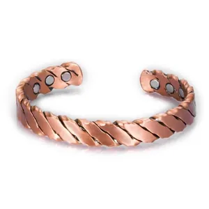 Detail shot of copper magnet therapy bracelet showing striped texture and magnets