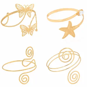 Set de cuatro elegantes brazaletes dorados con diseños de mariposa, estrella y espiral.