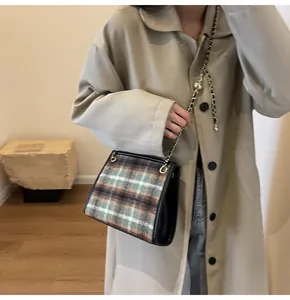 Stylish plaid woolen crossbody bag with gold chain strap for fashionable women
